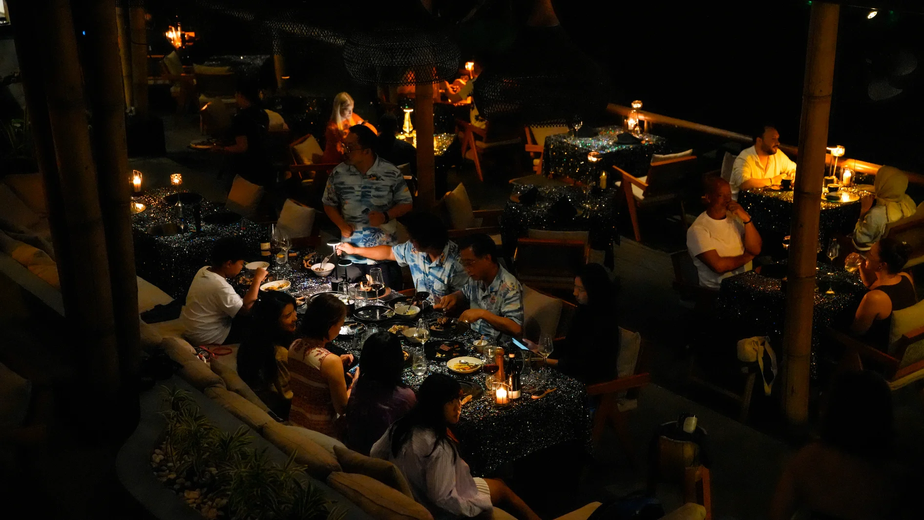 Guests Enjoying Festive Dinner at Akar Ubud Steakhouse Restaurant